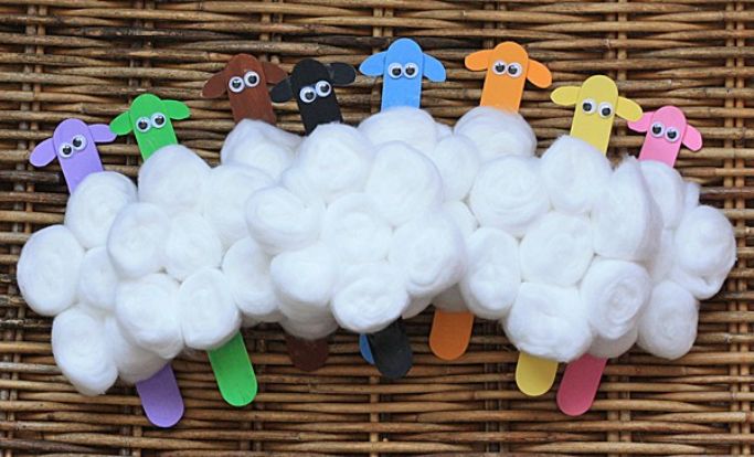 flock of sheep made with craft sticks and cotton