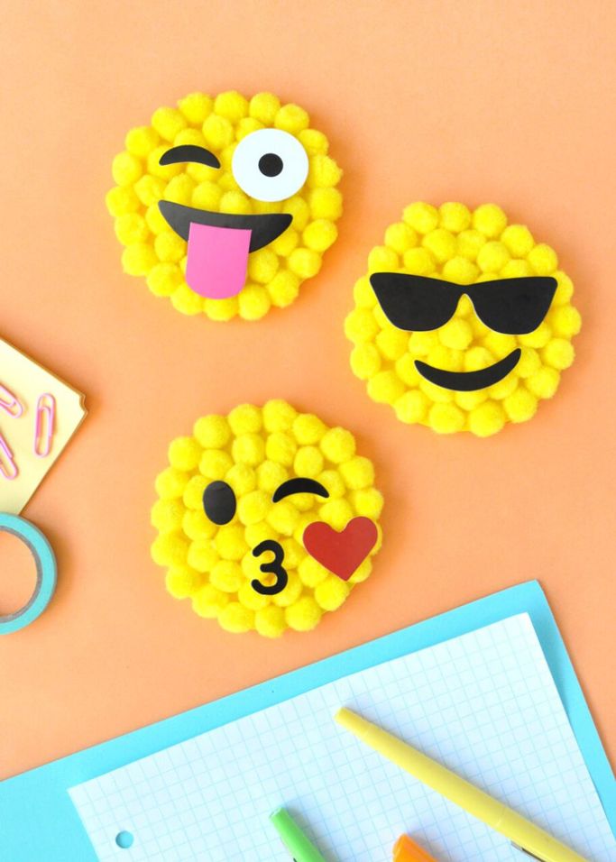 emojis made with yellow pom poms