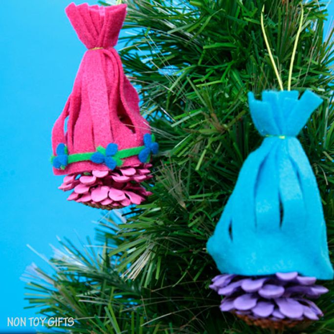 Trolls-inspired ornaments made with pine cones and felt